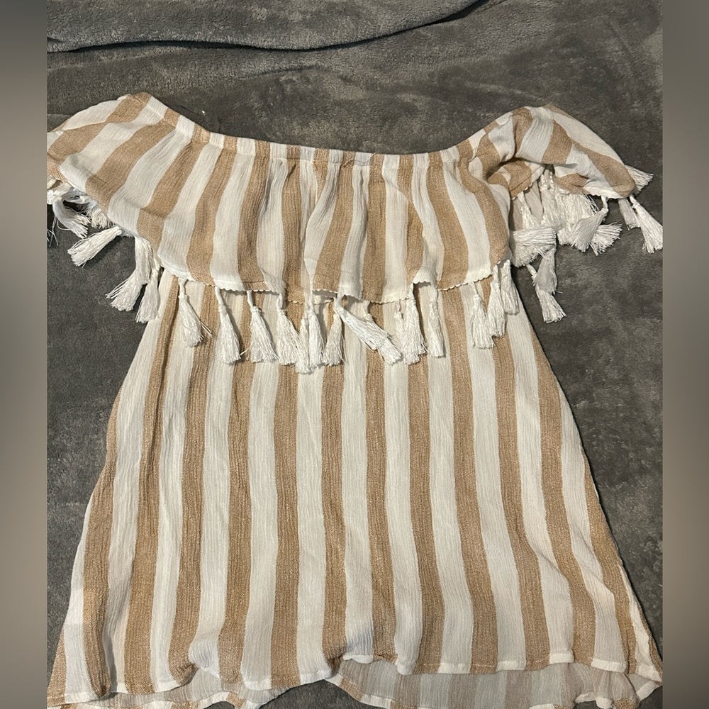 A medium size brown, and white blouse with tinsel
